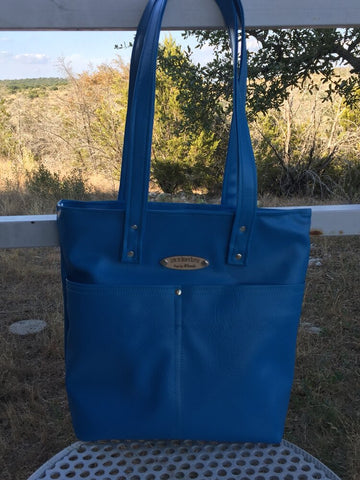 Handcrafted leather or vinyl totes are stylish, yet functional